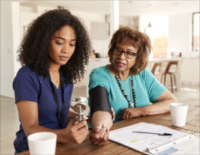 Caregiver checking elderly