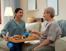 Caregiver giving food