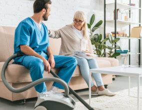 Caregiver cleaning floor