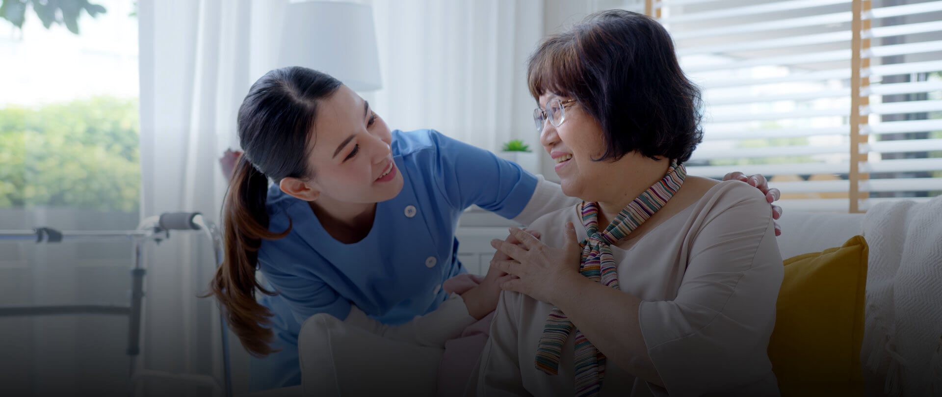 Caregiver talking to elderly