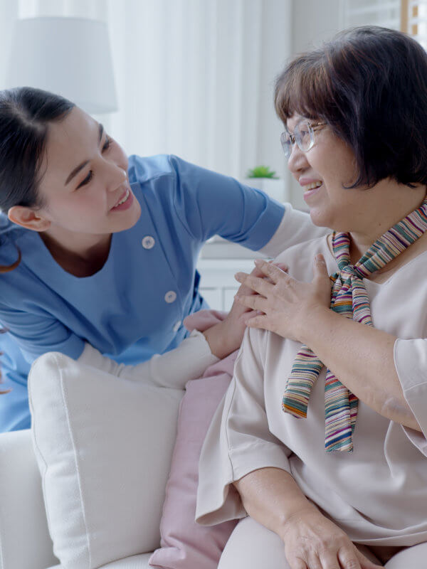 Caregiver talking to elderly