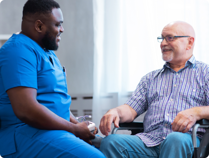 Caregiver talking to elderly